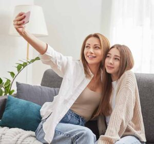 Mother and daughter smiling together